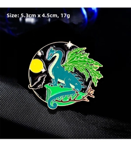 Macro view of flying dragon and moon enamel brooch showing 5.3cm x 4.5cm dimensions