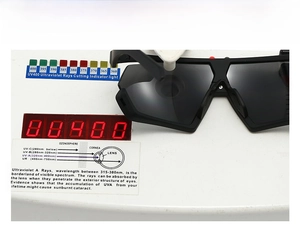 Detail view of large shield sunglasses undergoing UV400 protection testing on a device