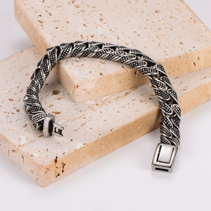 Vintage stainless steel polka dot chain bracelet with square buckle on marble