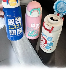 Detailed view of kids' cartoon water bottle with flip-top lid and colorful handle