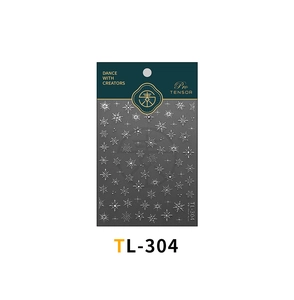 Detailed view of silver snowflake nail stickers TL-304 with white starburst patterns