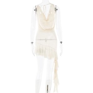 Detail of white backless dress with irregular ruffled hem and light chiffon fabric
