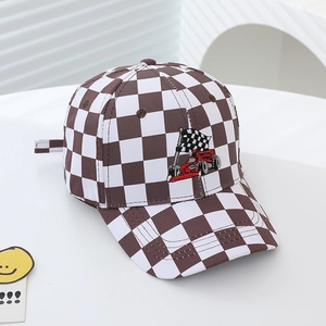 Close-up of kids checkered baseball cap with racing car embroidery and cotton texture