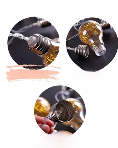 Detailed view of LED bulb connectors and internal golden copper filament string