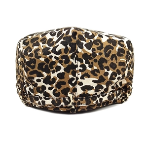 Detail of flat top military cap featuring leopard print fabric and adjustable back strap
