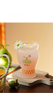 Detail of borosilicate glass with cherry pattern and checkerboard base for cold drinks