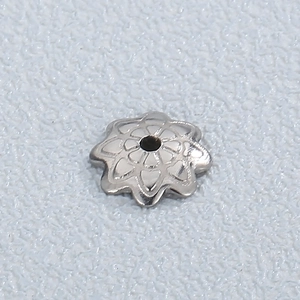 Silver hollow flower bead cap in stainless steel shown in macro view for jewelry making