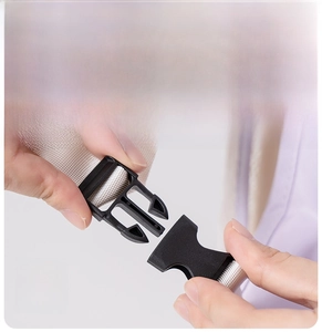 Close-up of quick-release side buckle on apron for easy fastening and removal