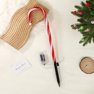 Detail of red and white LED candy cane path lights with battery box and stakes