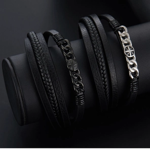 Detail of multi-layer braided black leather bracelet on a jewelry display stand