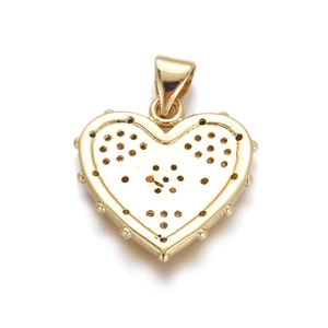 Detailed close-up of golden heart-shaped pendant with beaded edges and hollow back design