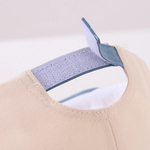 Detail view of the adjustable velcro strap on children's bear pattern baseball cap