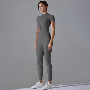 Close-up of dark grey high-elastic yoga jumpsuit featuring front zipper and sleek texture