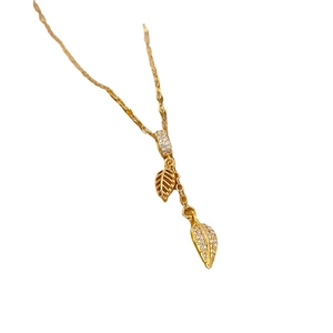 Elegant gold leaf tassel pendant necklace with zircon crystals on a white background