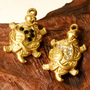 Gold turtle pendants with black and white crystals on wood, 304 stainless steel