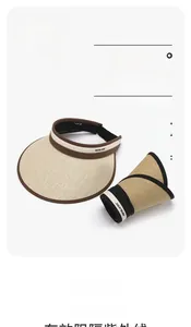 Detail of foldable UPF50+ straw sun hat with two-tone beige and brown woven texture