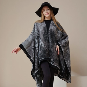 Elegante grijs-zwarte gebreide poncho met etnisch patroon en franjes voor dames