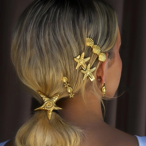 Goldenes Seestern-Haarclip-Set mit Muschelelementen für elegante Urlaubsfrisuren