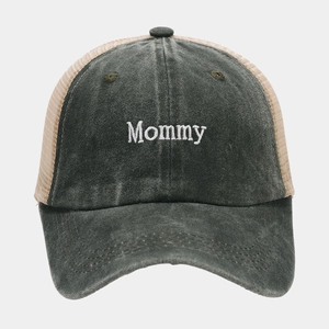 Detail of Mommy embroidery on washed dark gray mesh trucker cap with vintage texture