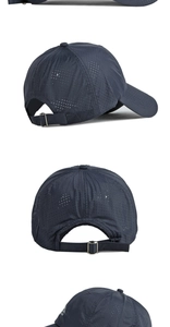 Detail of navy blue quick-dry baseball cap featuring breathable laser-cut holes and metal buckle