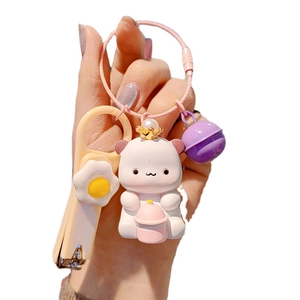 Cute crown bear resin keychain set with a fried egg charm and a purple bell accessory