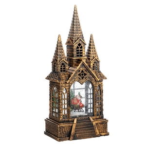 Vintage copper church snow globe with Santa Claus scene and detailed masonry texture