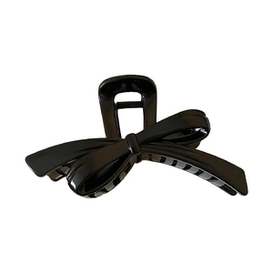 Elegant 3D black bow hair claw clip with a glossy finish for a minimalist Korean style look