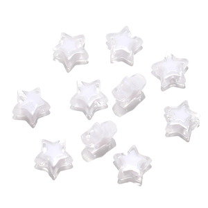Macro detail of acrylic star beads for DIY jewelry with white two-tone design
