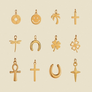Set of 12 gold stainless steel tarot charms featuring stars, moon and classic symbols