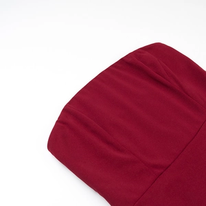 Detail shot of the wine red velvet fabric texture and clean seamless tailoring lines