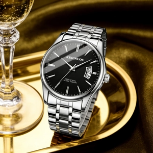 Detailed macro view of the Kingnuos silver steel watch dial with black face and date window