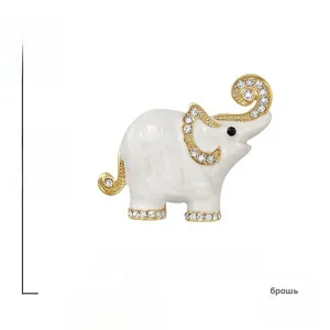 Detailed view of cute elephant brooch with crystal rhinestones and white enamel coating