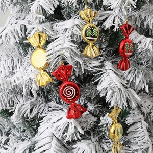 Christmas tree candy ornaments in red and gold with hanging strings and festive patterns
