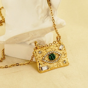 18K gold plated stainless steel malachite evil eye necklace shown on a white mannequin