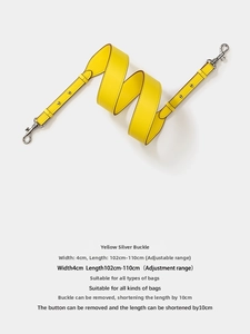 Detail of yellow leather bag strap with 4cm width and silver metal swivel hooks