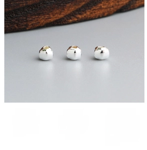 Detailed macro shot of irregular geometric S925 sterling silver triangle spacer beads