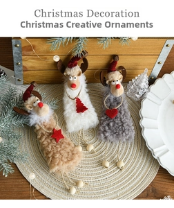 Detailed view of plush reindeer ornaments with knitted hats and wooden bead limbs