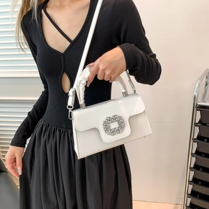 White faux leather crossbody bag with sparkling crystal buckle and ruched handle