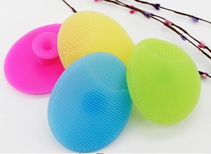 Macro shot of colorful silicone facial cleansing pads showing fine massage bristles