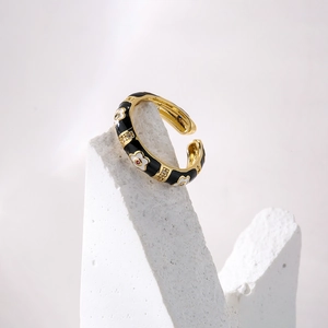 Bohemian 18K gold plated flower ring with black enamel and floral details on stone base