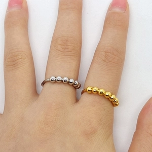 Anillos antiestrés minimalistas de acero inoxidable con cuentas en oro y plata