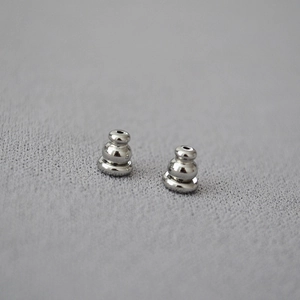 Macro shot of high-quality silver brass bullet earring backs with silicone grip for DIY