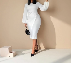 Detail of white lantern sleeves and slim waist cut on a long-sleeve midi dress