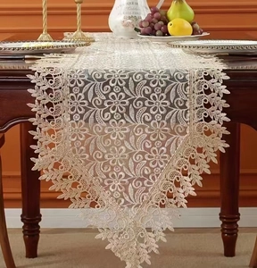 Elegant French lace table runner with hollow embroidery for dining room and coffee table decor.