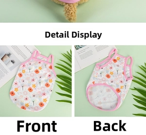 Detail of floral pet vest showing breathable mesh fabric and pink trim on mint background