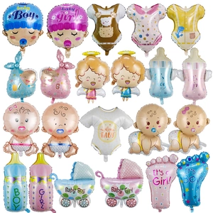Blue and pink baby shower foil balloons in shapes of baby heads, strollers and strollers