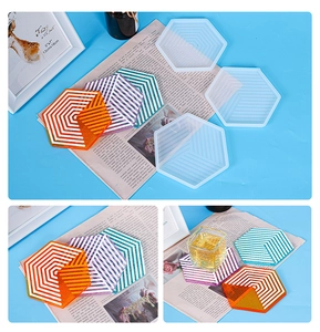 Hexagonal silicone resin mold detail showing geometric striped coasters and finished crafts