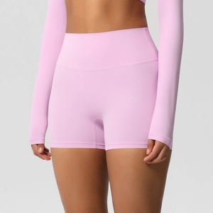 Close-up of pink high-waisted yoga shorts with elastic brushed fabric for fitness