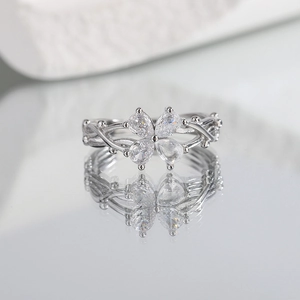 Lucky four-leaf clover ring with pear-cut cubic zirconia and twisted vine band