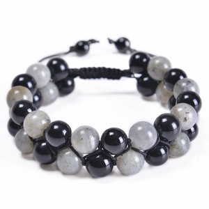 Detail of double-layer moonstone beaded bracelet with adjustable black braided cord